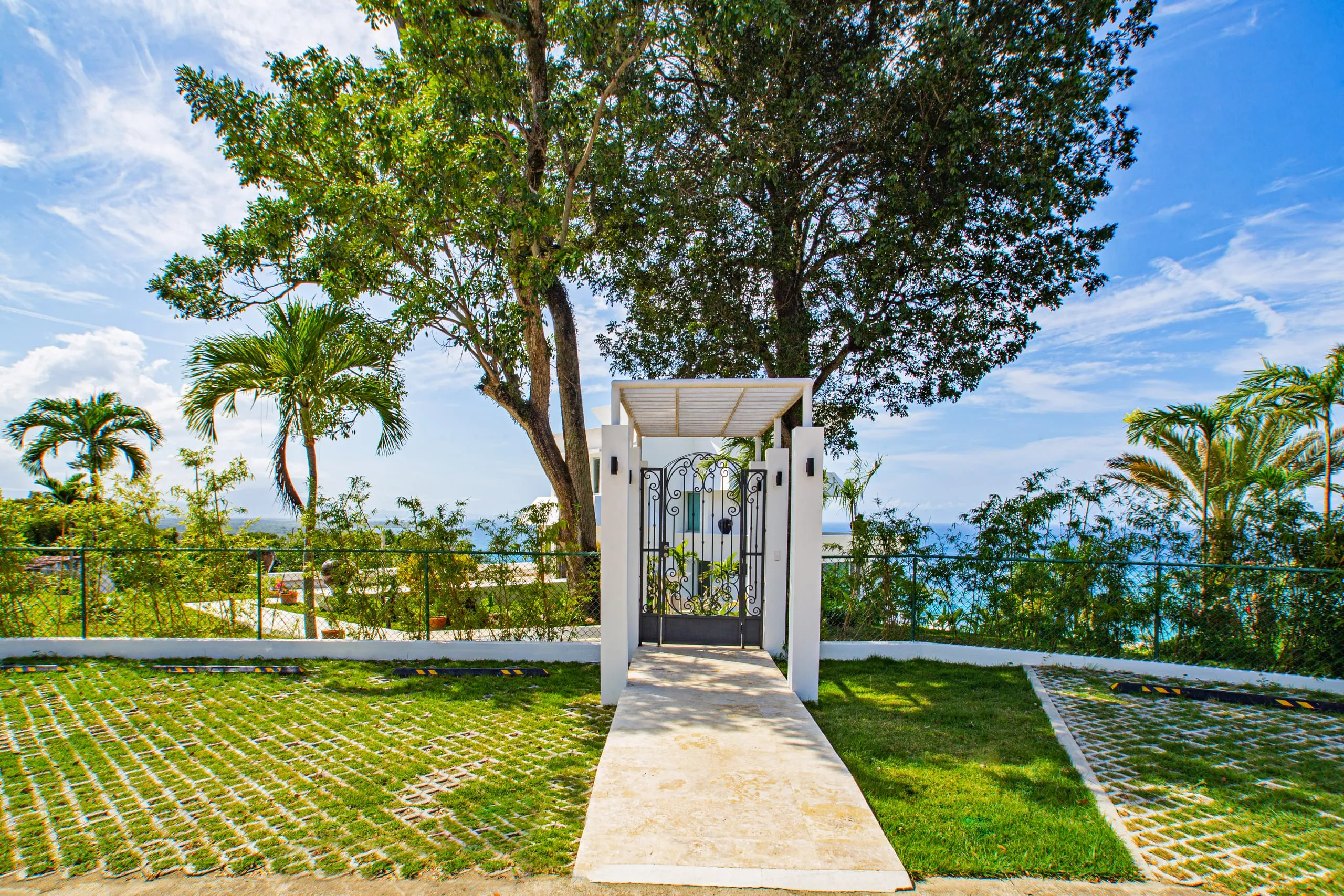 Pool deck and walkway with sweeping ocean views