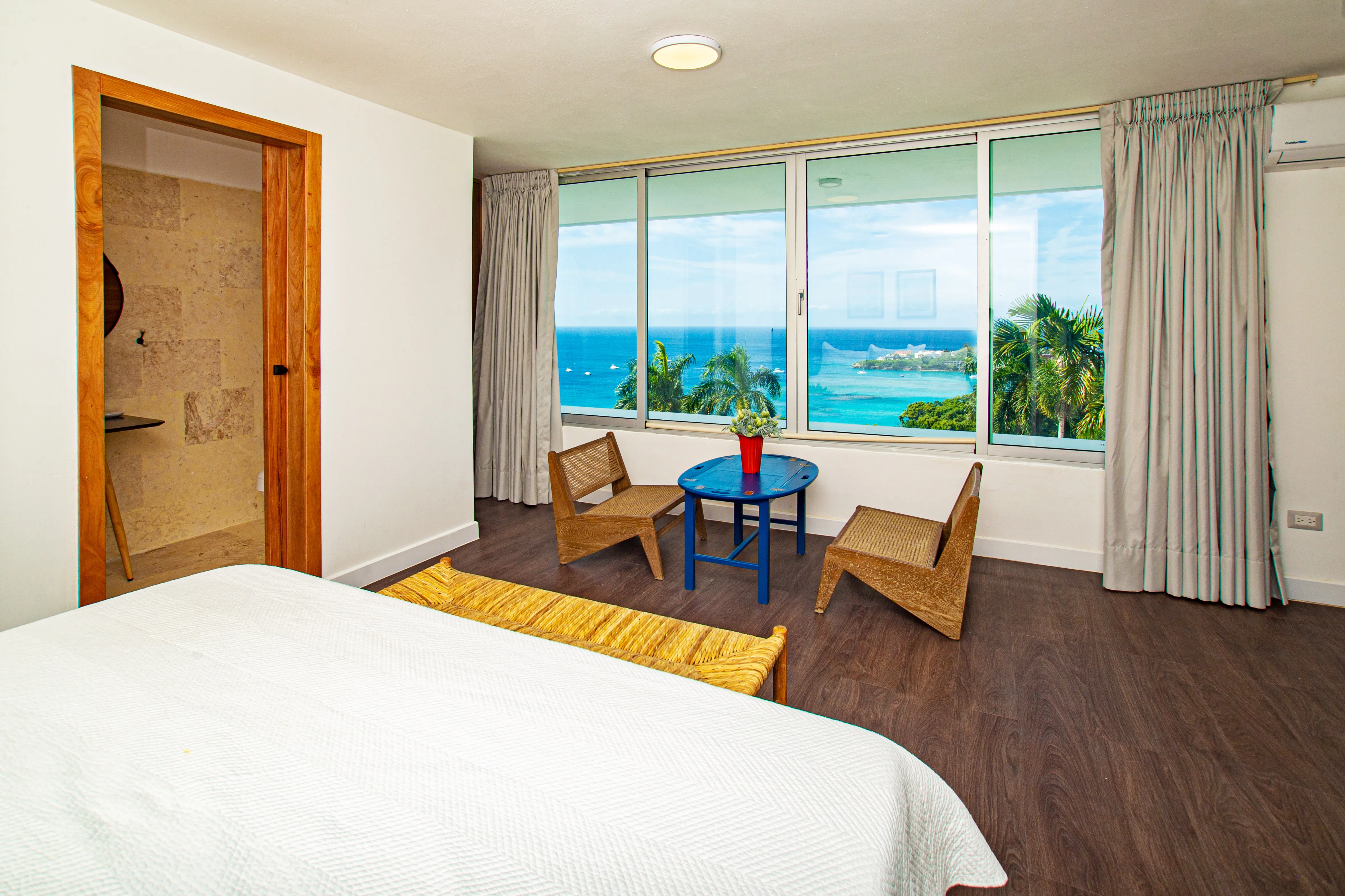 Bedroom 2 sitting corner with twin chairs and an ocean view