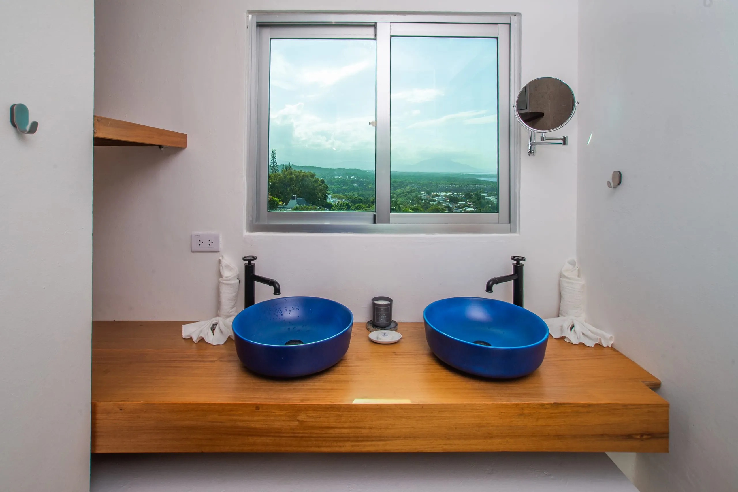 Bathroom with blue vessel sinks